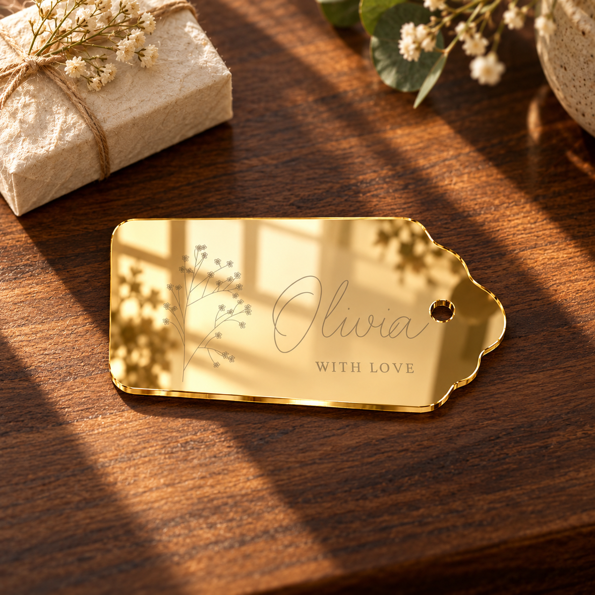 Personalised Mirror Acrylic Rectangle Wedding Gift Tags, Mirror Gold personalised example in a styled setting — digital scene visualisation. Selected tie option not shown; styling props not included.