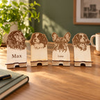 Four sample personalised wooden dog phone stands; price is for one stand. Digitally styled lifestyle image; props not included.