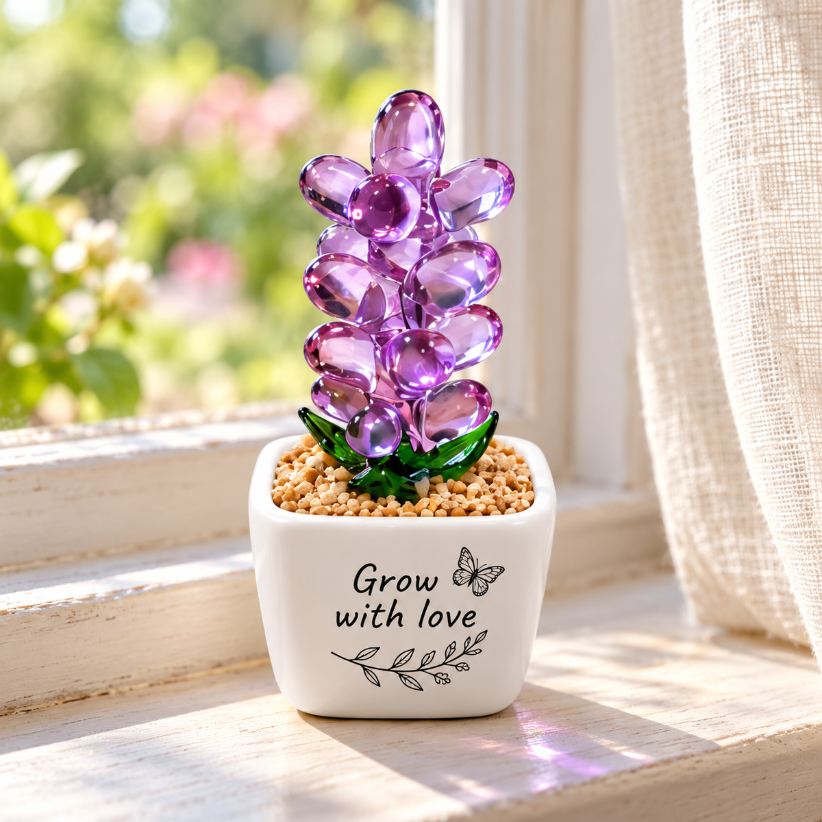 Purple glass hyacinth on a windowsill with butterfly and Grow with love artwork. Personalisation example; one selected pot per order; props not included.