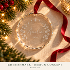 CherishMark glass-ornament: original AI-generated Christmas design concept, not an actual product photograph or tested engraving sample. Physical scale illustrative; props not included. Light frosted-engraving visualisation; not opaque printed ink or a guaranteed physical finish.