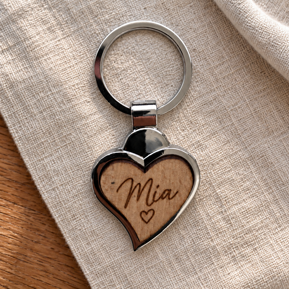 Mia name engraving example on wooden front; generated illustration, not a photographed finished sample