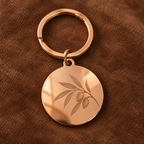 AI visualisation of a rose gold mirror keyring with a botanical engraving example