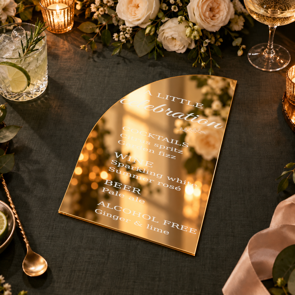 Digital lifestyle visualisation of gold mirror and frosted acrylic wedding bar menu; exact original engraving; styling props not included.