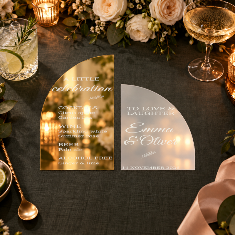 Digital lifestyle visualisation of gold mirror and frosted acrylic wedding bar menu; exact original engraving; styling props not included.