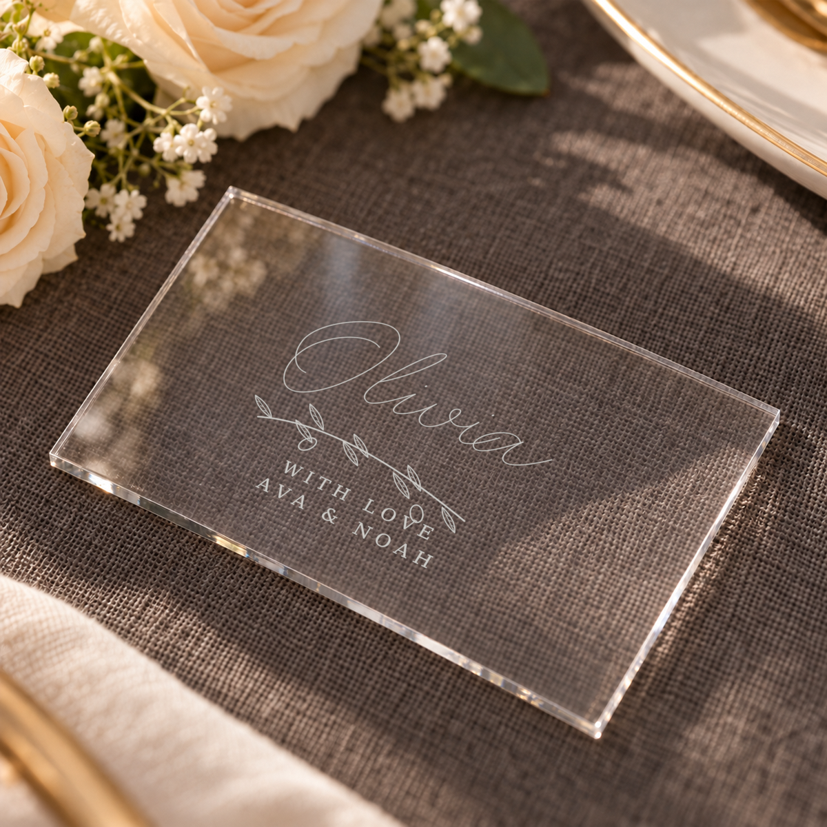 Digital oblique detail visualisation of clear acrylic Olivia wedding place card; exact original engraving; styling props not included.