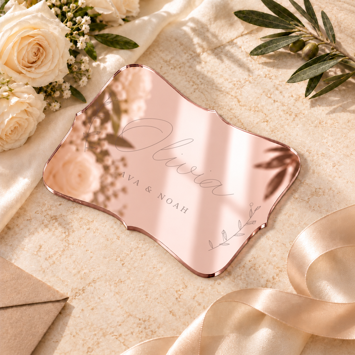 Digital lifestyle visualisation of Olivia mirror acrylic place card in mirror rose gold; exact original engraving; styling props not included.