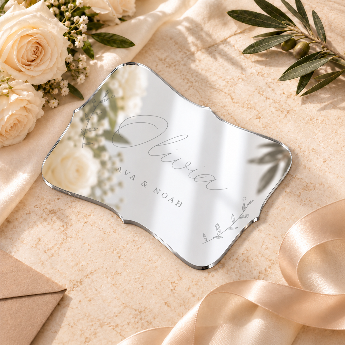 Digital lifestyle visualisation of Olivia mirror acrylic place card in mirror silver; exact original engraving; styling props not included.