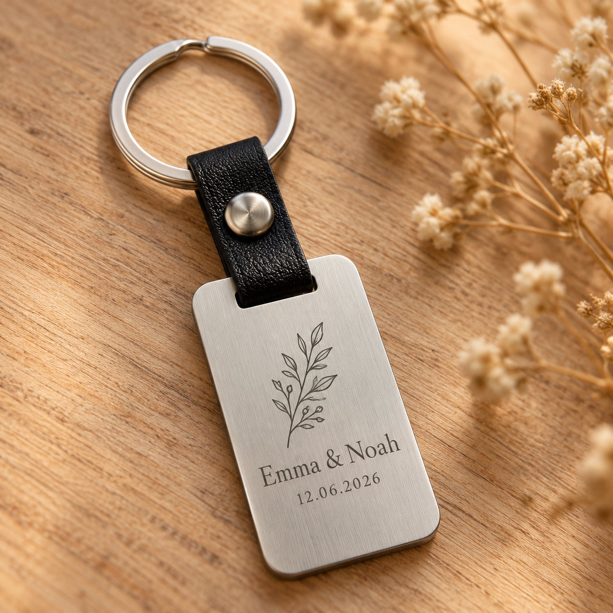 AI illustrative silver brushed stainless steel and black leather keyring: 06-date