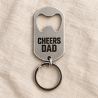 Silver brushed stainless steel bottle opener keyring, custom text example; generated visualisation based on actual product photo, engraving examples; styling props not included