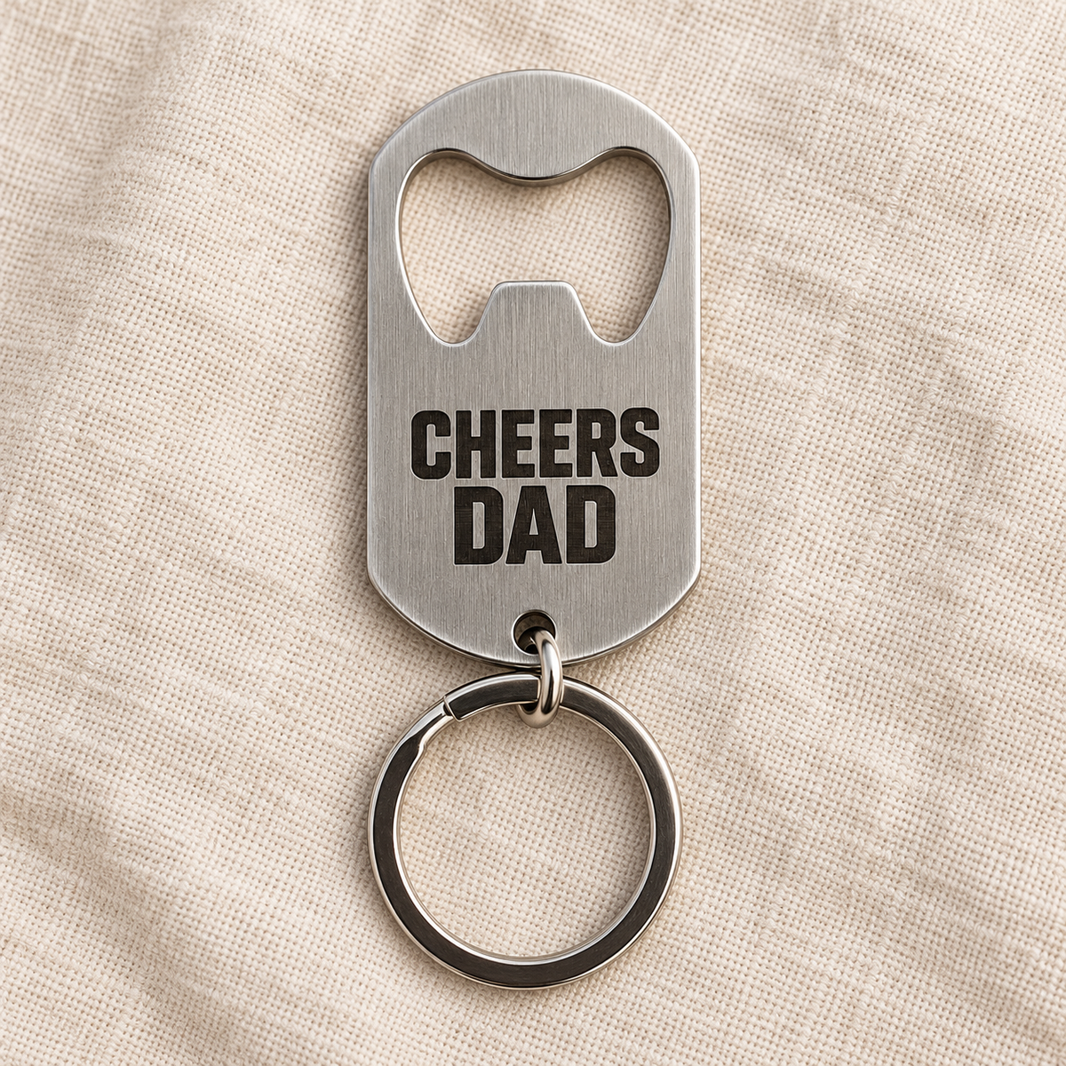 Silver brushed stainless steel bottle opener keyring, custom text example; generated visualisation based on actual product photo, engraving examples; styling props not included