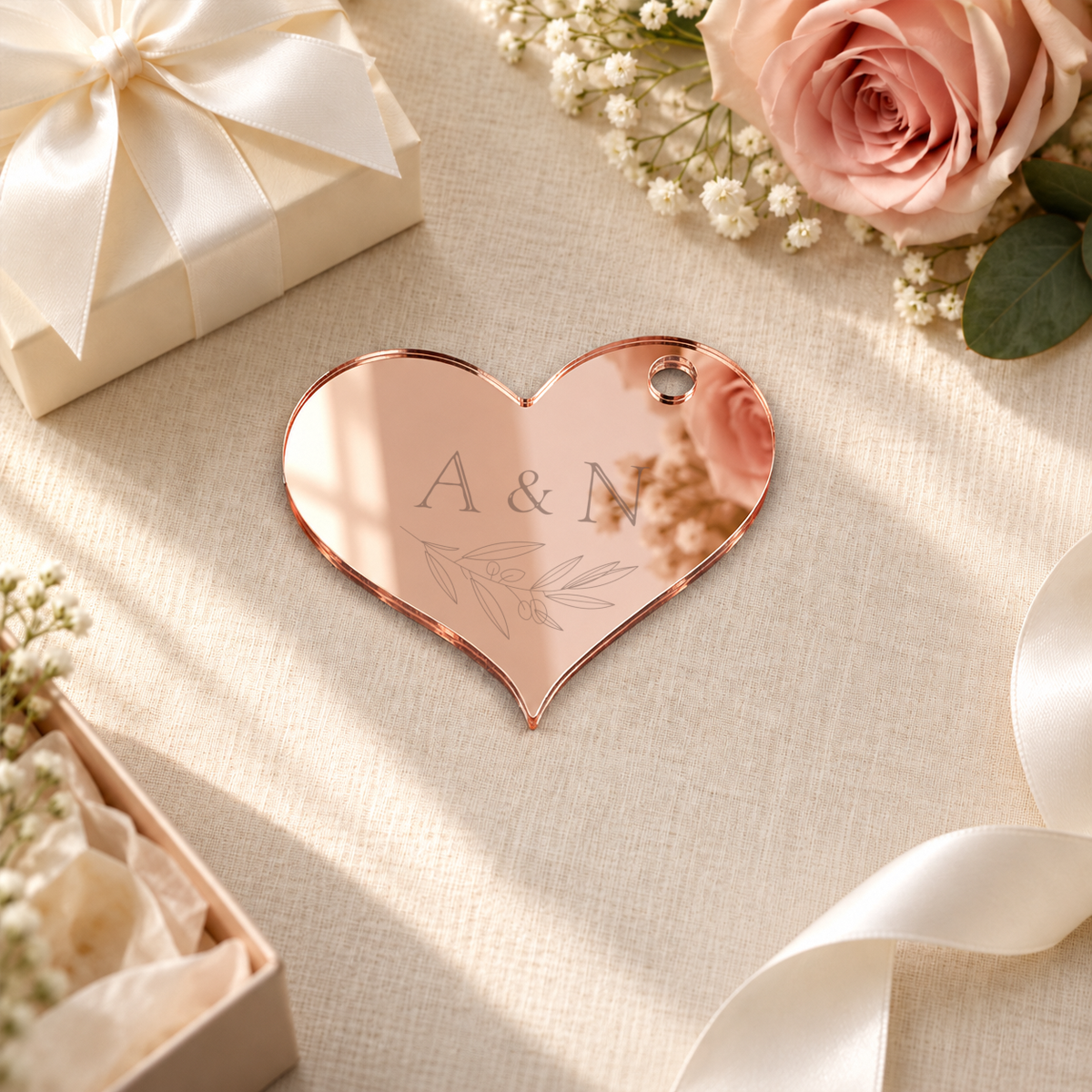 Mirror Rose Gold heart acrylic wedding gift tag, personalized engraving example — digital scene visualization. Selected tie option not shown; styling props not included.