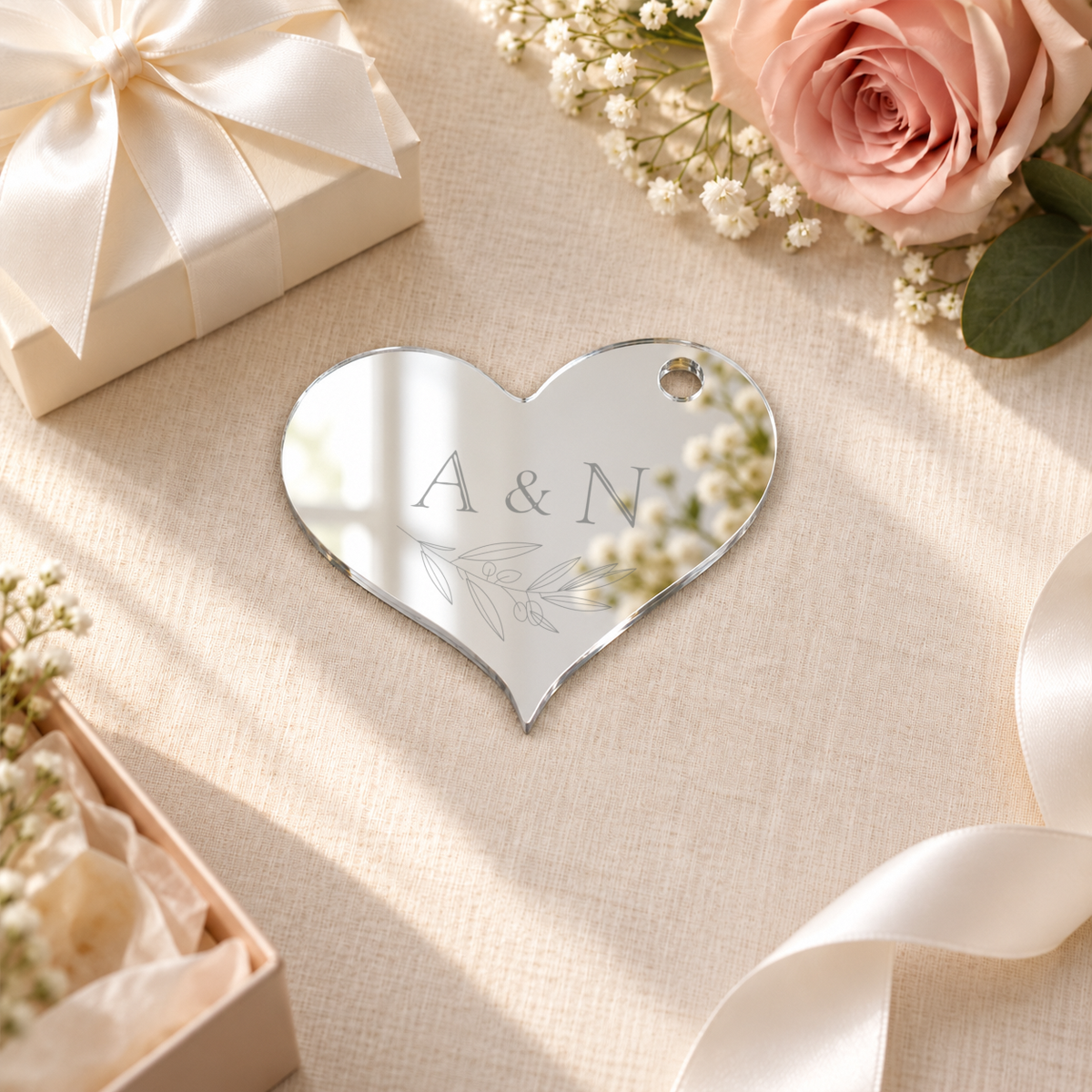 Mirror Silver heart acrylic wedding gift tag, personalized engraving example — digital scene visualization. Selected tie option not shown; styling props not included.